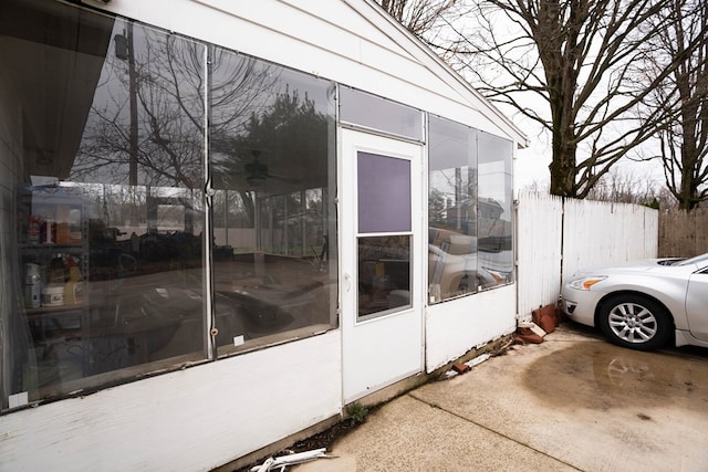 view of home's exterior featuring fence