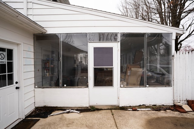 exterior space featuring a sunroom