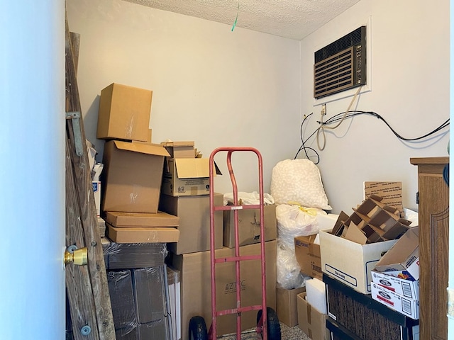 storage room with a wall mounted air conditioner