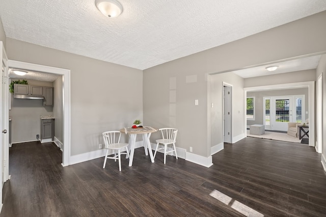 459 Glessner Ave, Mansfield, OH 44903 - dining area with dark wood-style floors, baseboards, and a textured ceiling