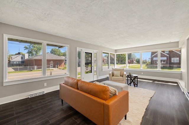 459 Glessner Ave, Mansfield, OH 44903 - sunroom featuring baseboards, a textured ceiling, and wood finished floors