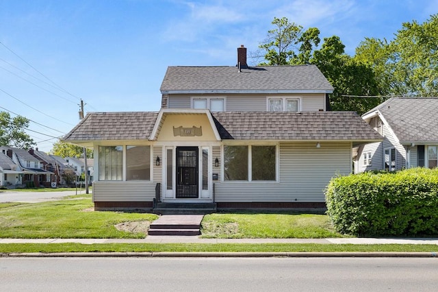 459 Glessner Ave, Mansfield, OH 44903 - view of front facade with a front yard, a chimney, and a shingled roof