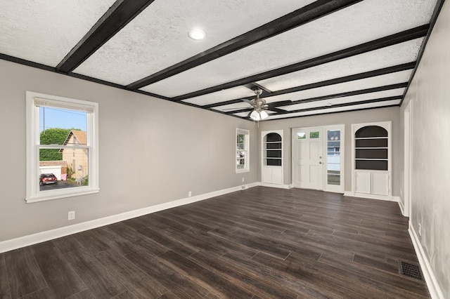 459 Glessner Ave, Mansfield, OH 44903 - unfurnished living room featuring beam ceiling, a ceiling fan, dark wood finished floors, baseboards, and healthy amount of natural light