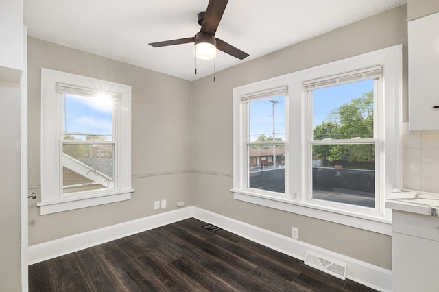 459 Glessner Ave, Mansfield, OH 44903 - empty room with dark wood-style flooring, baseboards, and a ceiling fan