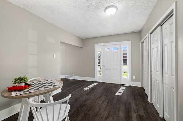 459 Glessner Ave, Mansfield, OH 44903 - foyer entrance featuring baseboards, a textured ceiling, and wood finished floors