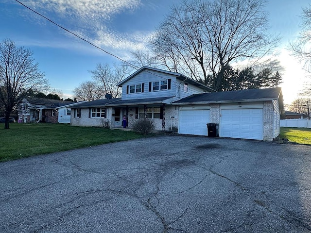 view of property with a yard and a garage