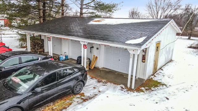 view of snow covered garage