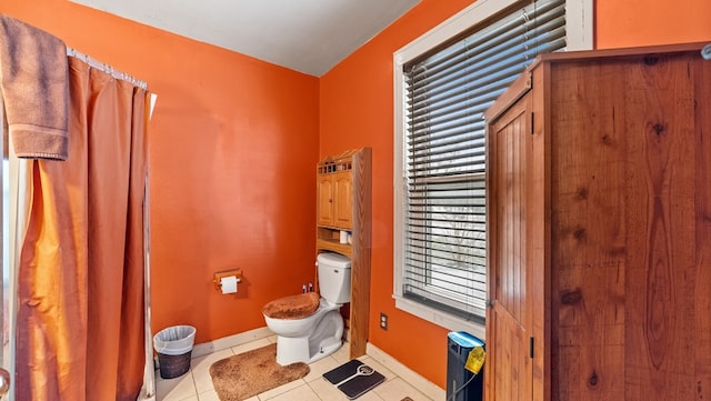 bathroom featuring tile patterned floors and toilet