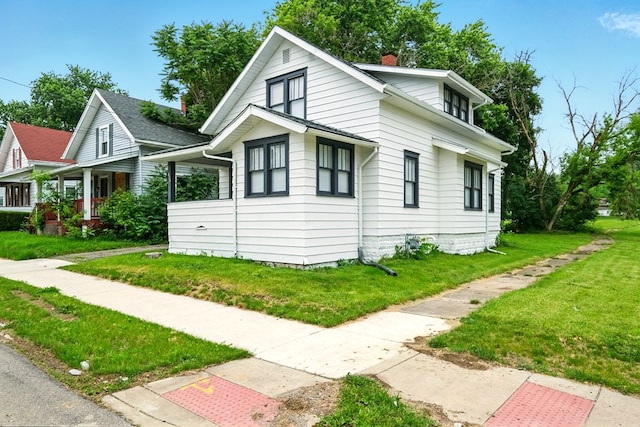 411 Grace St, Mansfield, OH 44902 - view of side of home with a lawn and a chimney
