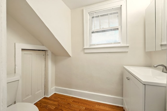 411 Grace St, Mansfield, OH 44902 - bathroom with vanity, wood finished floors, baseboards, and toilet