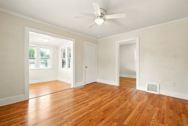 411 Grace St, Mansfield, OH 44902 - unfurnished room featuring light wood-type flooring, ornamental molding, a ceiling fan, and baseboards