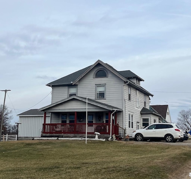 view of front of house featuring a front yard and covered porch