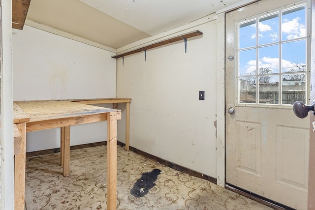 interior space featuring baseboards