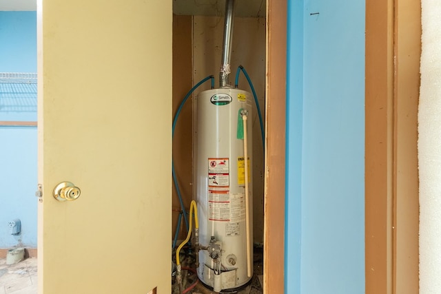 utility room with water heater