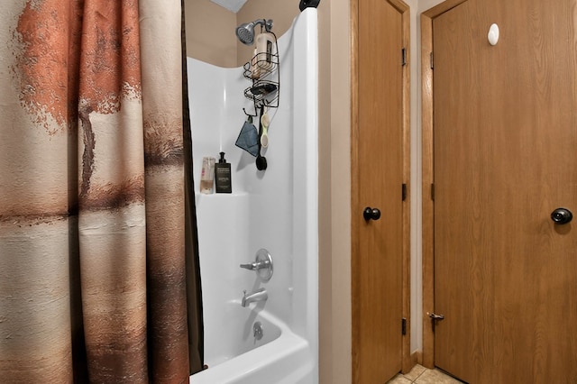 full bathroom featuring shower / bath combo with shower curtain and tile patterned flooring