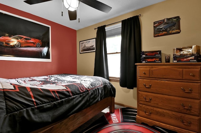 bedroom featuring ceiling fan and carpet flooring