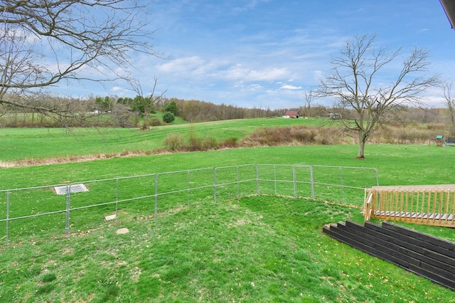 view of yard with a rural view and fence
