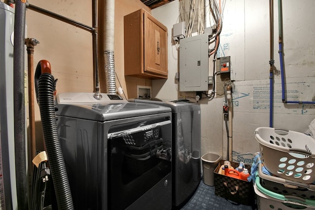 laundry area with cabinet space, independent washer and dryer, and electric panel