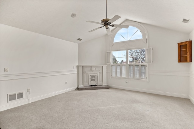 unfurnished living room featuring ceiling fan, a fireplace with raised hearth, and visible vents