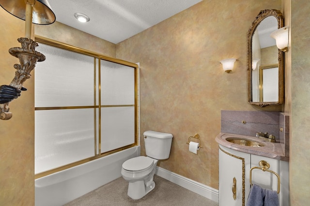 bathroom with vanity, enclosed tub / shower combo, toilet, and a textured ceiling