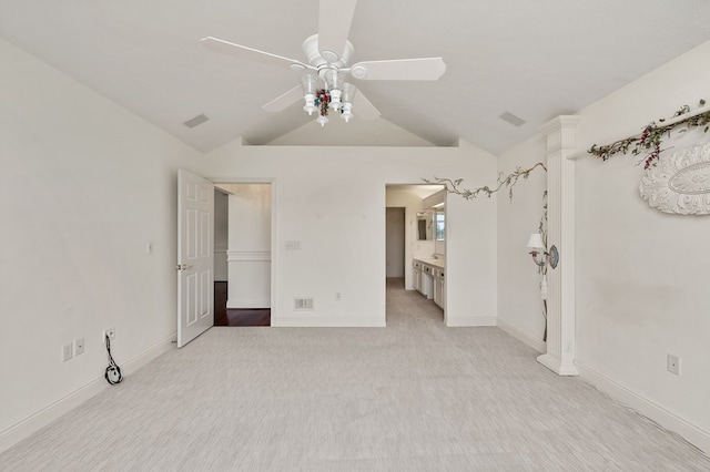 unfurnished bedroom featuring visible vents, a ceiling fan, baseboards, and lofted ceiling