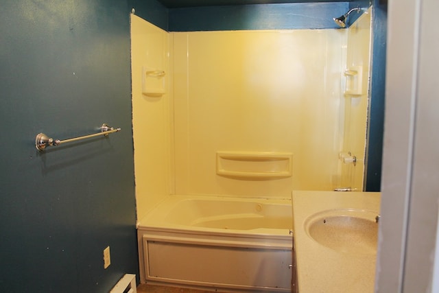 bathroom featuring shower / bathtub combination and sink