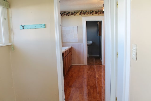 corridor featuring dark hardwood / wood-style floors