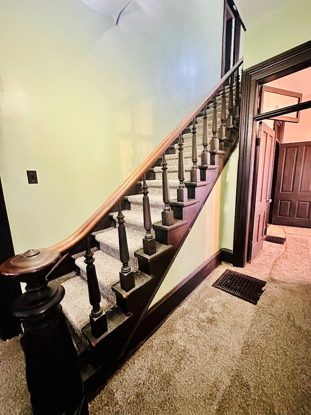 stairs with carpet floors