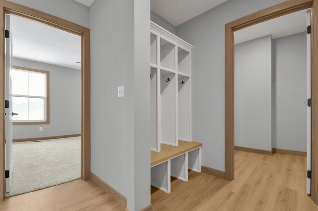 113 Gables Blvd, Lexington, OH 44904 - mudroom with light wood finished floors and baseboards