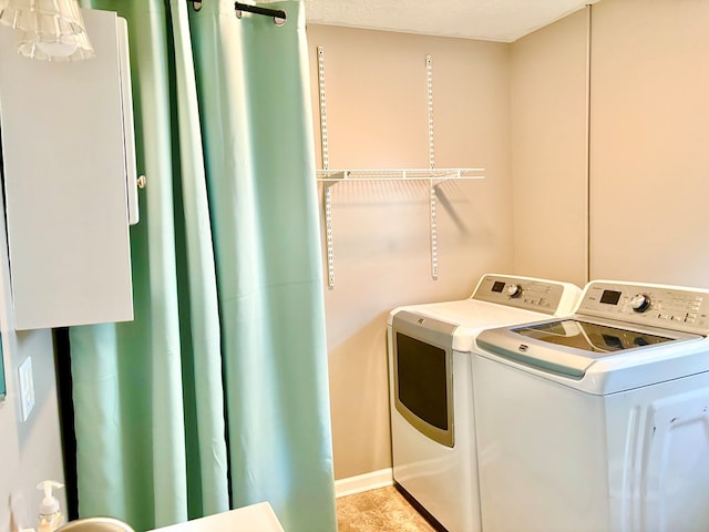 laundry area with laundry area and washing machine and dryer