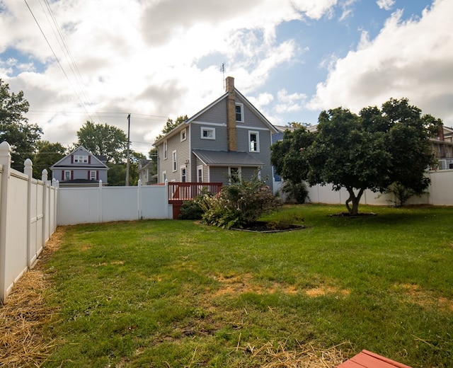 view of yard with a wooden deck