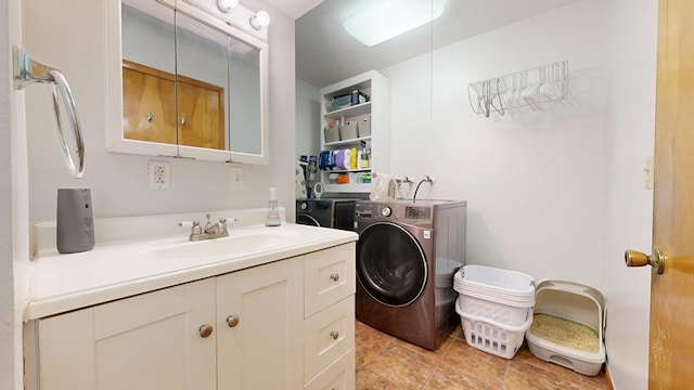 135 W Smiley Ave, Shelby, OH 44875 - bathroom featuring washing machine and clothes dryer, vanity, and tile patterned flooring