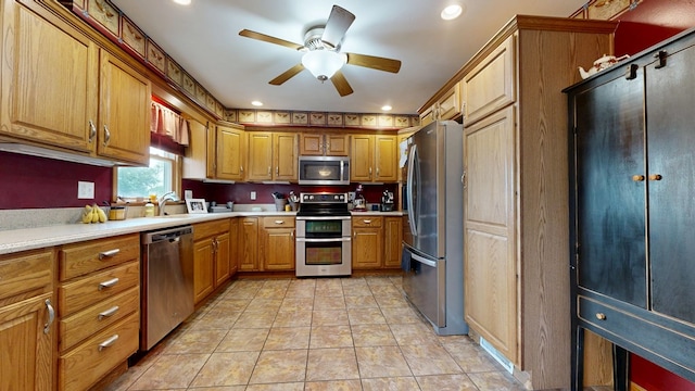 135 W Smiley Ave, Shelby, OH 44875 - kitchen featuring appliances with stainless steel finishes, ceiling fan, light countertops, brown cabinetry, and recessed lighting