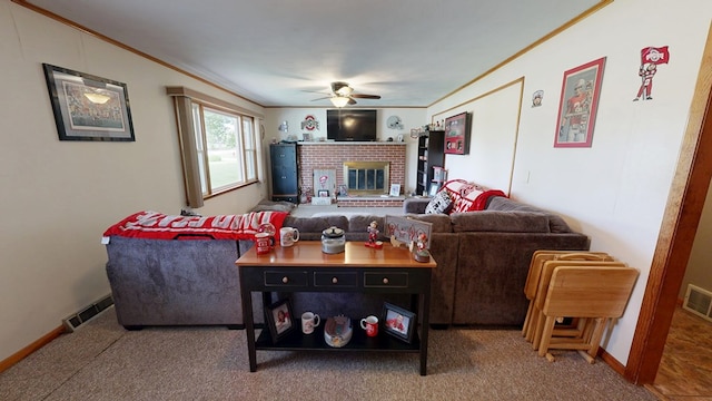 135 W Smiley Ave, Shelby, OH 44875 - living area featuring crown molding, a ceiling fan, a brick fireplace, and carpet flooring