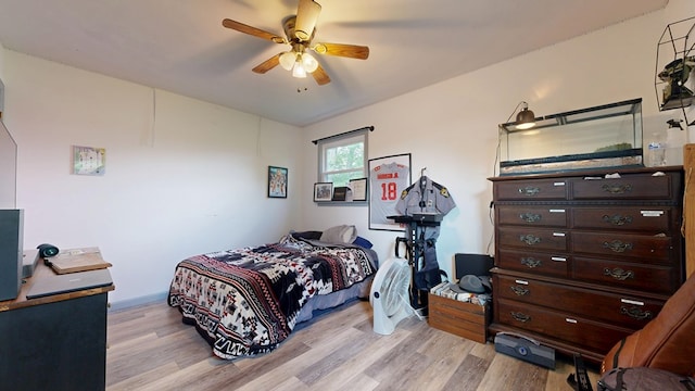 135 W Smiley Ave, Shelby, OH 44875 - bedroom with light wood-type flooring and a ceiling fan