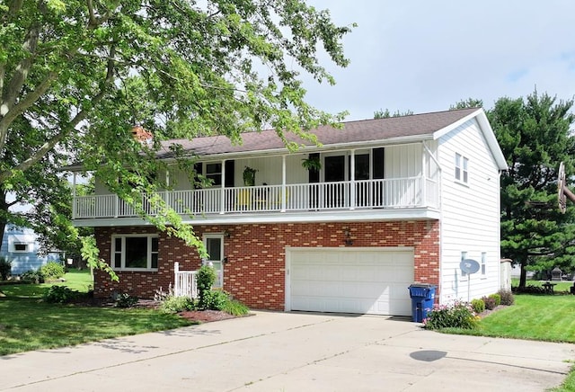 135 W Smiley Ave, Shelby, OH 44875 - front facade featuring an attached garage, a balcony, a front lawn, driveway, and brick siding