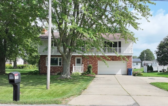 135 W Smiley Ave, Shelby, OH 44875 - view of front facade featuring a garage, brick siding, a balcony, concrete driveway, and a front lawn