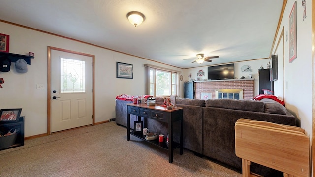 135 W Smiley Ave, Shelby, OH 44875 - carpeted living room with a ceiling fan, ornamental molding, and a fireplace