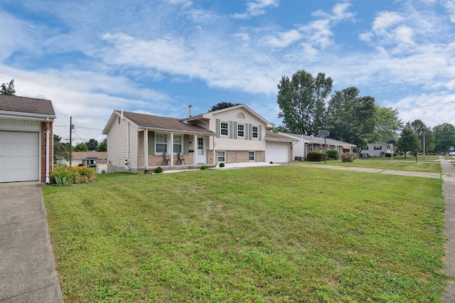 tri-level home with a garage, covered porch, and a front yard