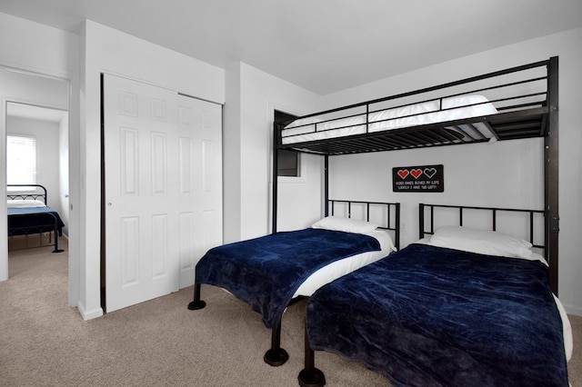 carpeted bedroom featuring a closet