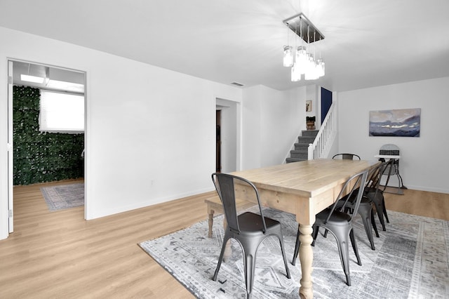 dining space with light wood-type flooring