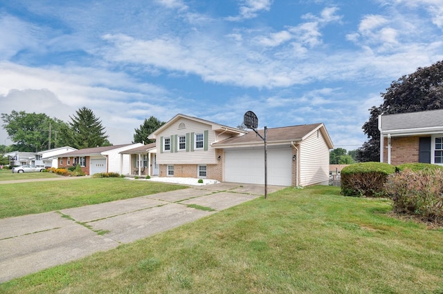 tri-level home with a garage and a front yard