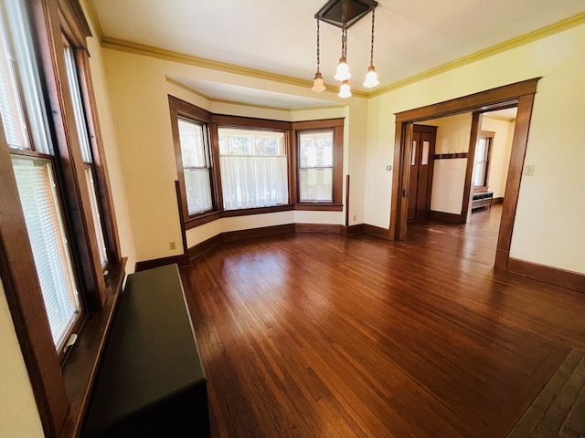 empty room with ornamental molding, dark wood-style floors, and baseboards