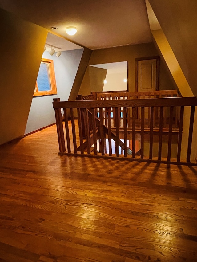 bonus room featuring wood finished floors