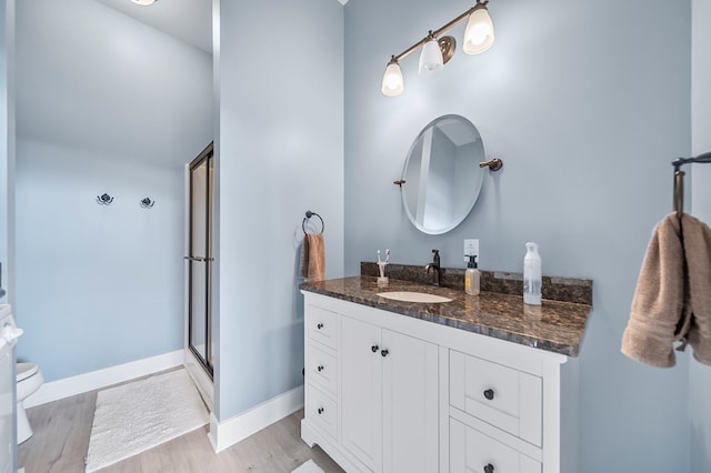 7326 State Route 19, Mount Gilead, OH 43338 - full bathroom with vanity, an enclosed shower, and wood finished floors