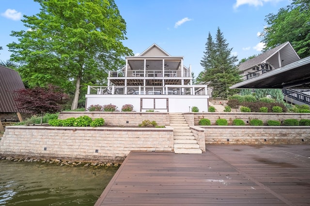 7326 State Route 19, Mount Gilead, OH 43338 - rear view of house featuring a sunroom, stairs, and a deck with water view