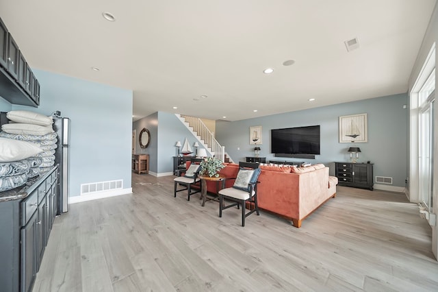 7326 State Route 19, Mount Gilead, OH 43338 - living room featuring light wood-type flooring, stairway, and recessed lighting