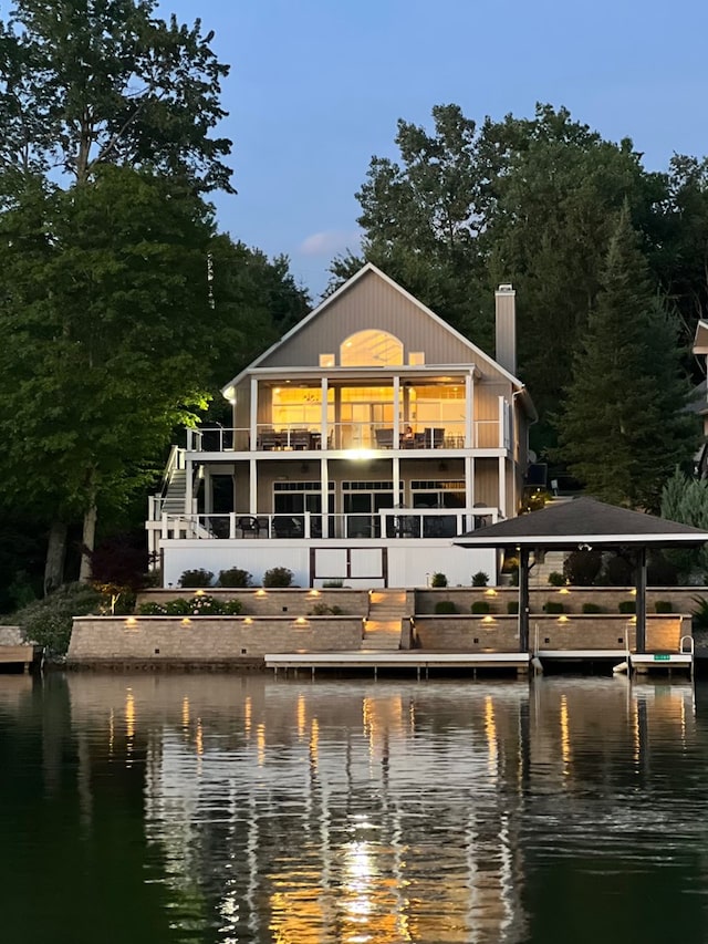 7326 State Route 19, Mount Gilead, OH 43338 - back of property with a water view, a balcony, a chimney, and stairs