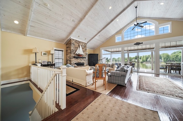 7326 State Route 19, Mount Gilead, OH 43338 - living area featuring plenty of natural light, a stone fireplace, hardwood / wood-style flooring, high vaulted ceiling, and a water view