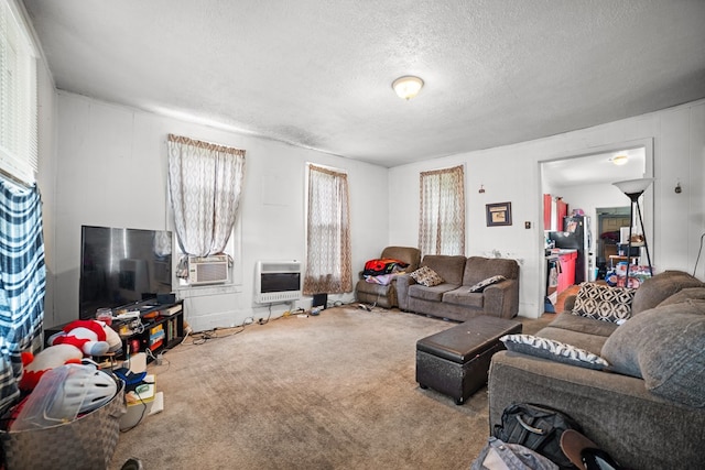 carpeted living room with cooling unit, a textured ceiling, and heating unit